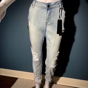 Light blue Jeans with 50 % Distress on it